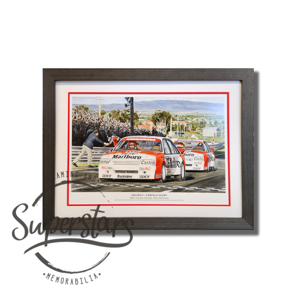 This colour sketch shows 2 VK Commodore placing first and second place at 1984 Hardie Ferodo 1000. There is a white border and red trim. The frame is a dark charcoal colour and has a wood grain pattern on it. Holden Bathurst memorabilia