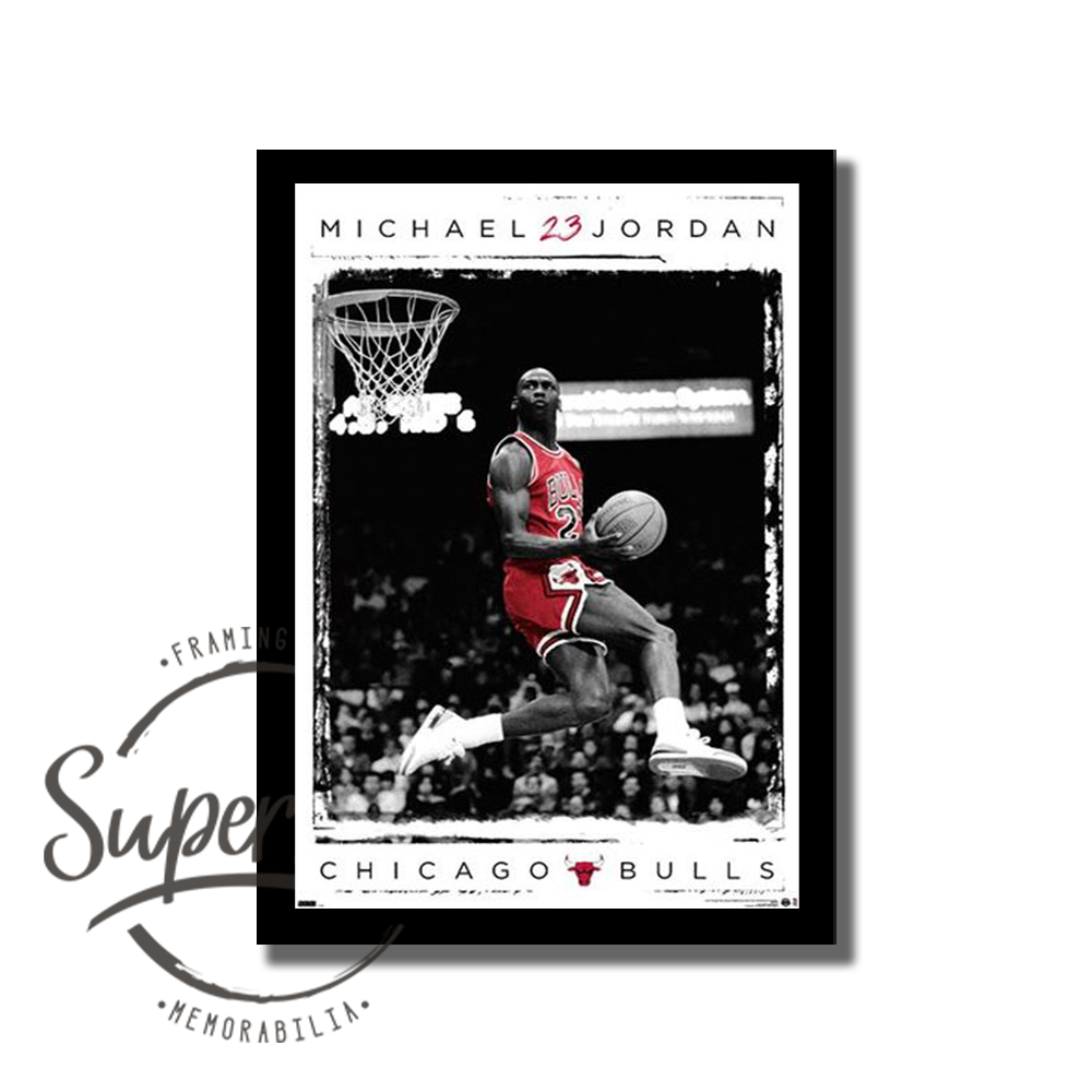 A black and white photo of Michael about to dunk the ball. Michael's chicago bulls uniform is the only colour on the poster. Across the top it reads Michael 23 Jordan. Along the bottom it reads Chicago Bulls with the logo