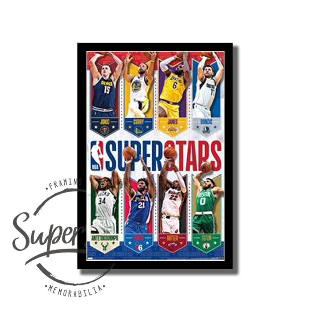 NBA Superstars poster. Features Lebron James, Nikola Jokić, Steph Curry, Luka Dončić, Giannis Antetokounmpo, Joel Embiid, Jimmy Butler and Jayson Tatum in action shots. Across the middle of the poster is the word Superstars. Custom framed in a black timber frame.