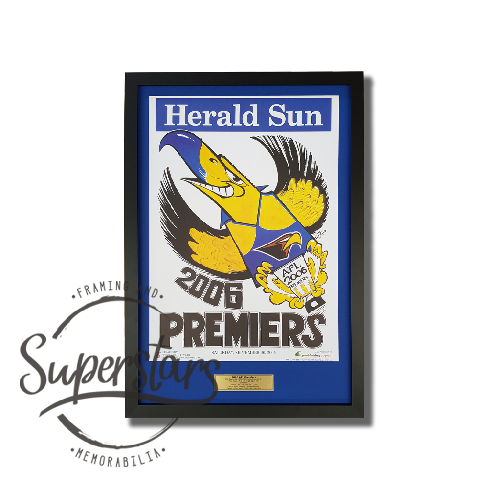2006 AFL Premiers West Coast Eagles - A cartoon eagle is the main feature, with the word Premiers across the bottom. This has been framed with a blue border, black timber frame and gold plaque.