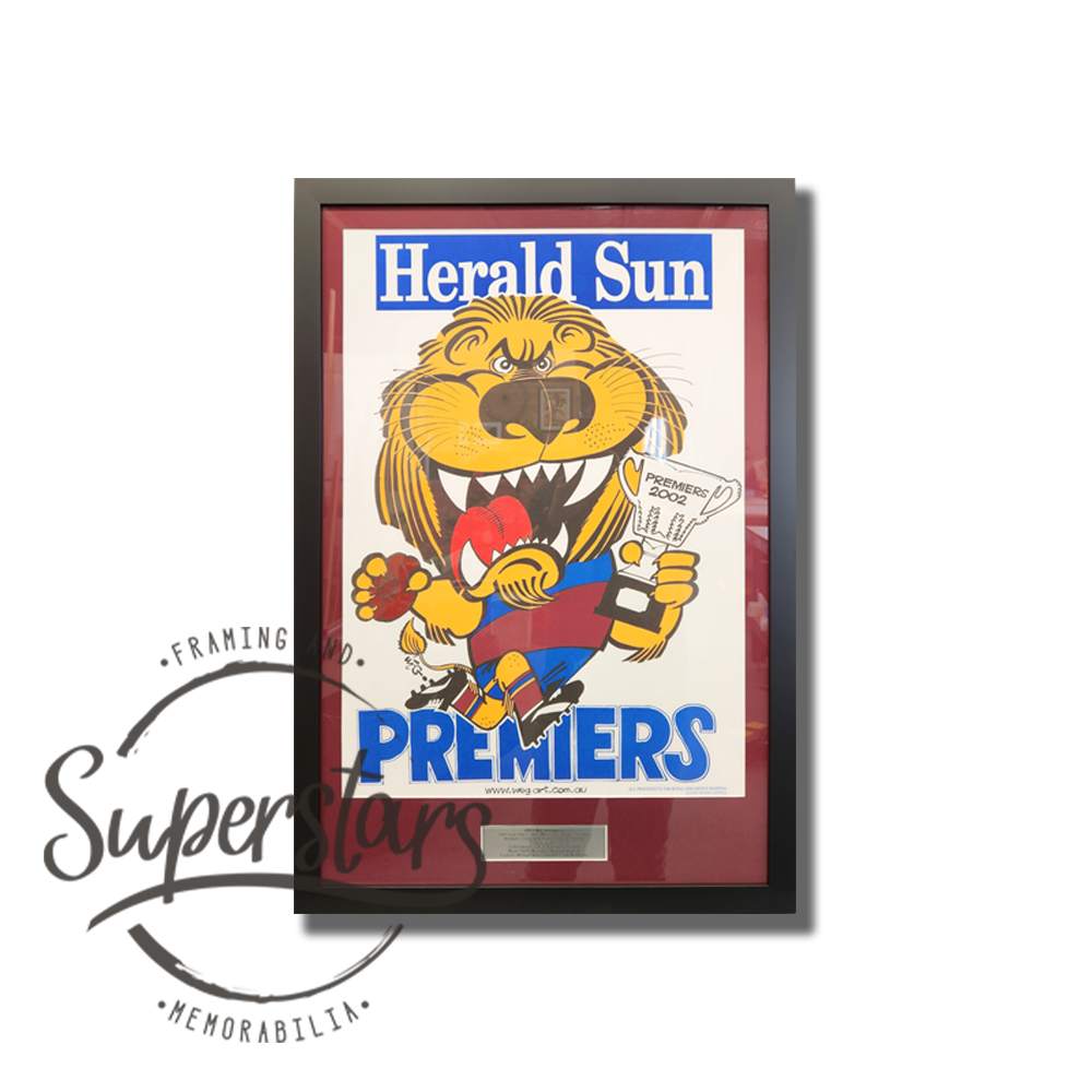 Brisbane Football Club Premiership Memorabilia: A cartoon of the Lion winning the 2002 AFL Premiership. It has a heading that reads Herald Sun