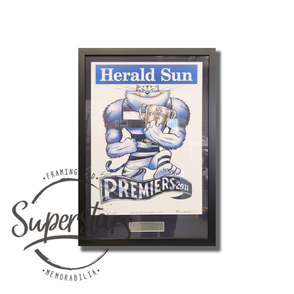 Geelong Premiership Memorabilia: A cartoon of the Geelong Cats winning the 2011 AFL Premiership. It has a heading that reads Herald Sun