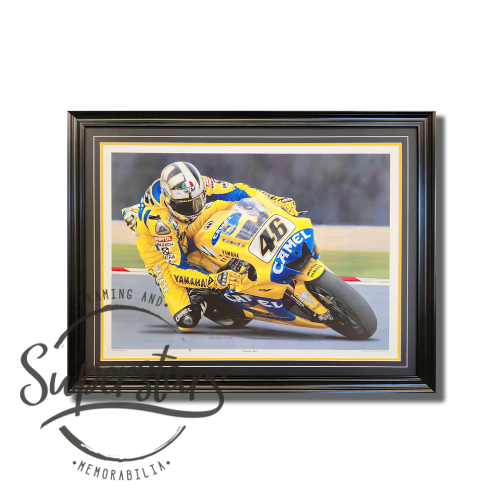 This impressive piece of Valentino Rossi memorabilia is a sketch of Rossi riding his yellow, Yamaha motorbike. The picture has been framed with a black border and black frame.
